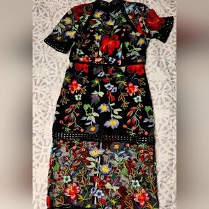 Size M (8) Vone Floral Embroidered Black Dress With Shear Hem And Cut Out Waist.
